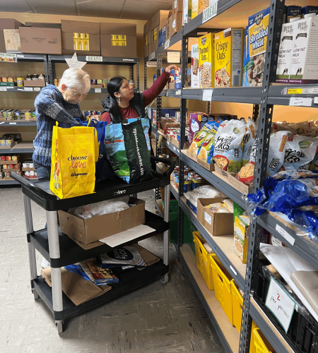 Volunteer packing bag of food